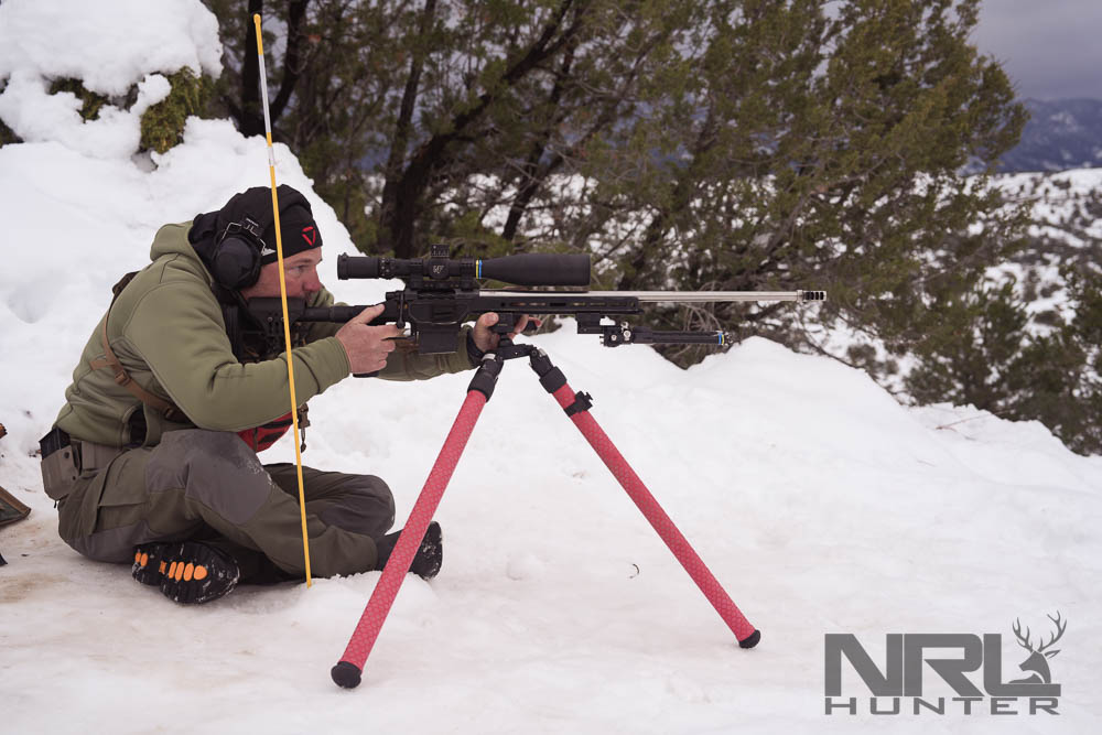 Shooter in snow tests rifle accuracy in cold weather